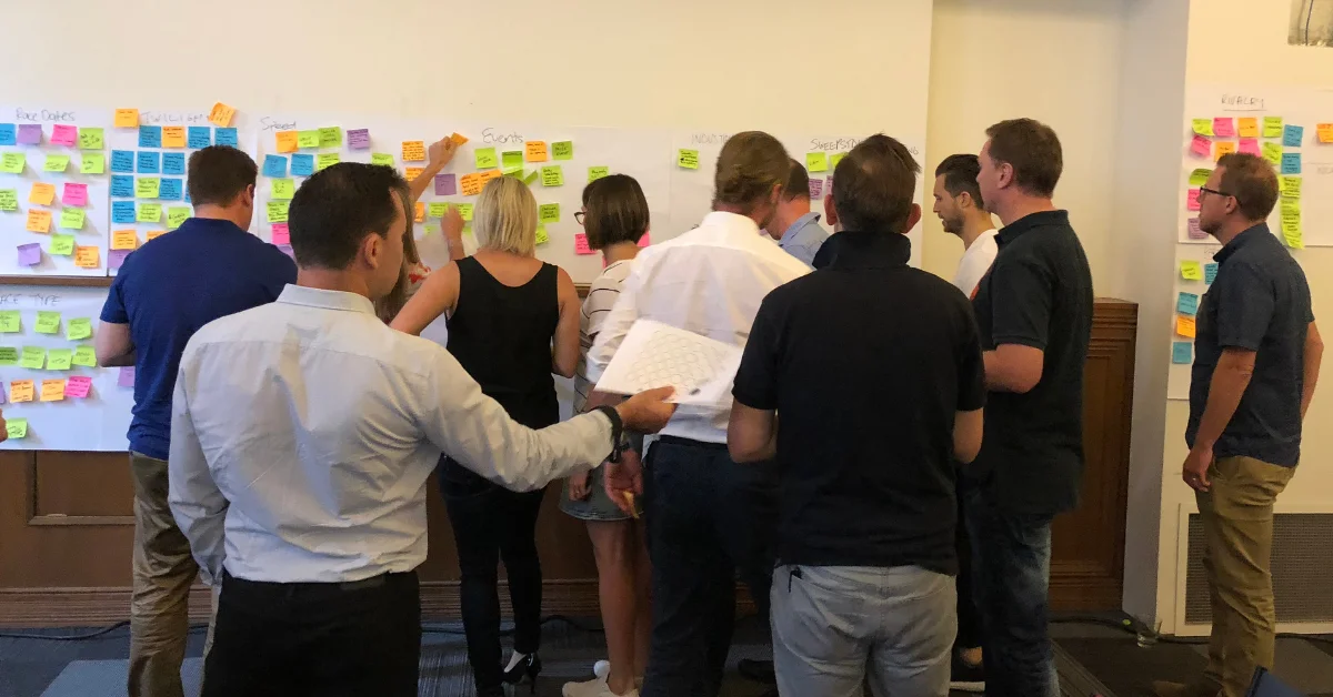 Hack Day participants sharing and recording their ideas.